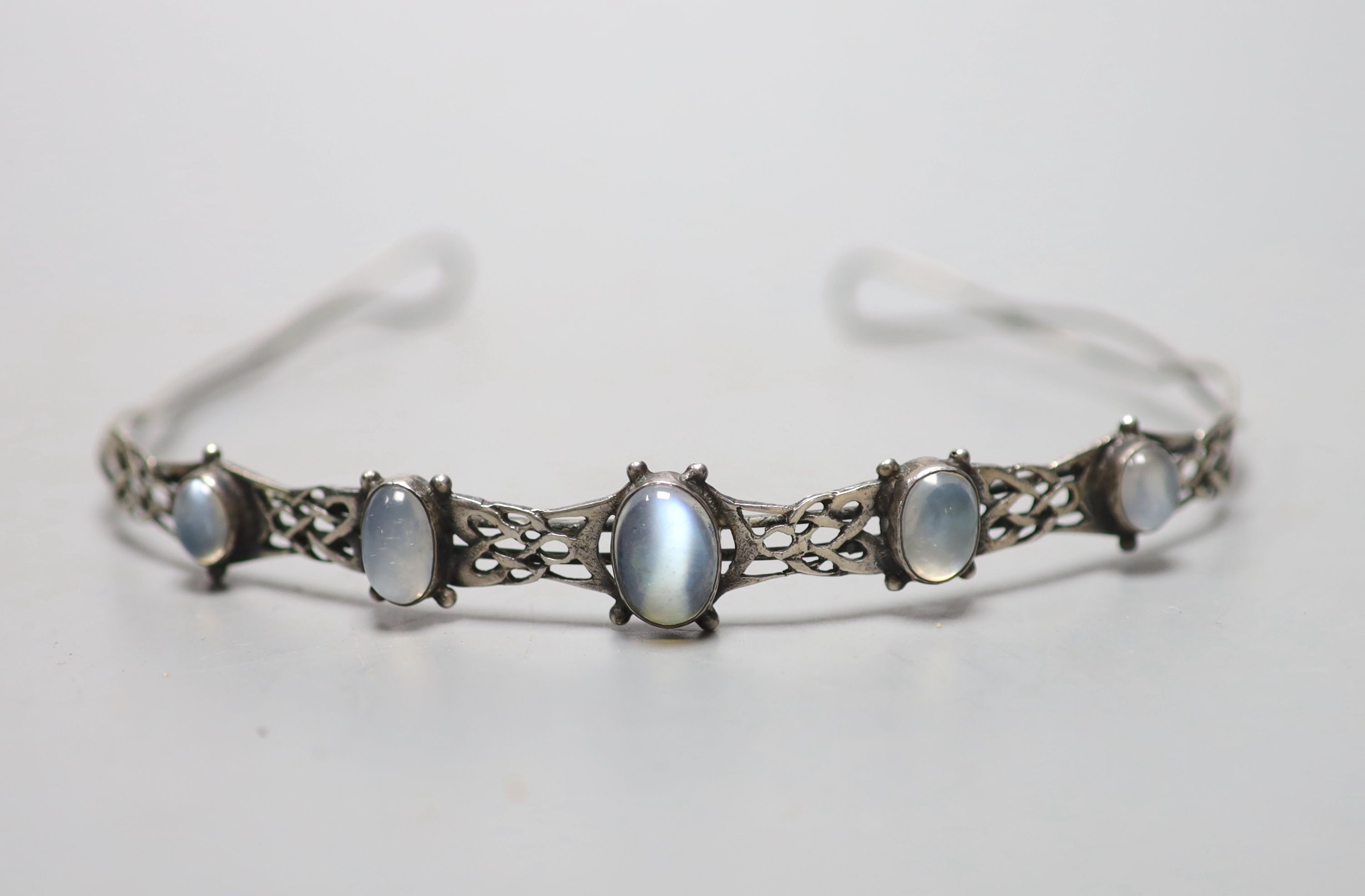 A white metal and graduated five stone cabochon moonstone set tiara, diameter 12.5cm